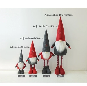Detail view of four extendable Christmas gnomes in various sizes from 65cm to 160cm