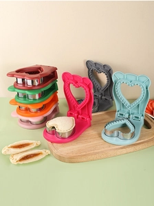 Detail of heart sandwich cutter with stainless steel ring and multi-color plastic shells