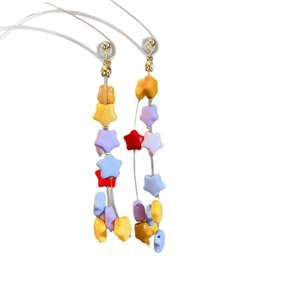 Handmade colorful star beaded dangle earrings with vibrant resin stars and gold hardware