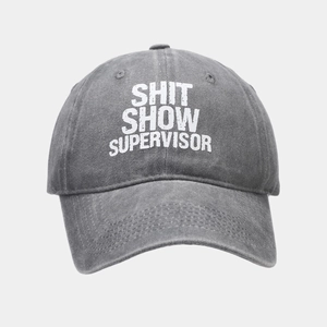 Detail of washed grey cotton baseball cap with white Shit Show Supervisor print text