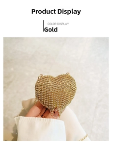 Close-up of a gold heart-shaped evening clutch bag encrusted with sparkling rhinestones