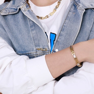 Close-up of two-tone gold and silver infinity link necklace and bracelet jewelry set