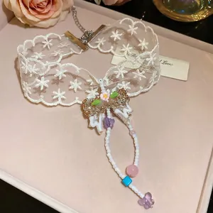 Lace bow choker necklace with floral charms and beaded tassel pendant for women