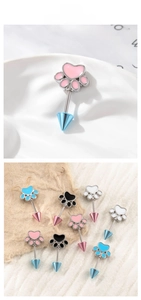 Detail of cat paw screw back cartilage stud earrings with colorful enamel and cone ends