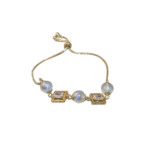 Adjustable gold mermaid pearl bracelet with rectangular cubic zirconia accents