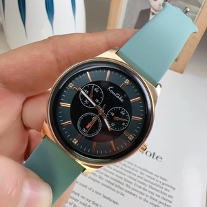 Women's quartz sports watch with rose gold case, rhinestones, and mint green silicone strap
