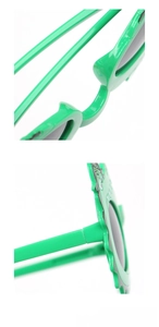 Detailed close-up of green crocodile sunglasses nose pads and sturdy frame hinges