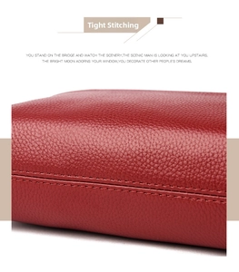 Macro shot of durable double stitching on high-quality red lychee pattern leather