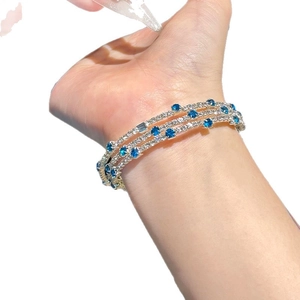 Elegant three-layer geometric silver bracelet with blue gemstones and white zircons