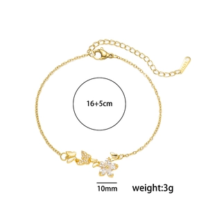 Bracelet doré en acier inoxydable avec breloques fleurs et papillons et cristaux