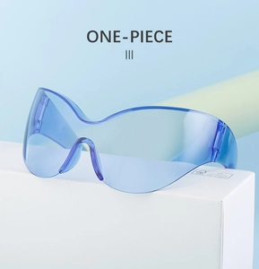Detail showing the one-piece blue oversized lens and modern rimless frame of sport sunglasses