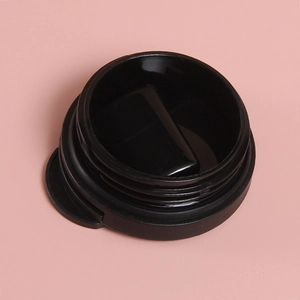 Detail showing the black plastic lid with threaded interface and secure flip-top closure