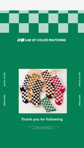 Detail of checkered crew socks in various colors displayed on a retro wooden tray