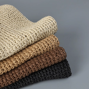 Handwoven straw sun hats in beige, tan, brown and black colors with a chic bucket style