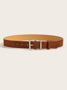 Detailed view of brown suede waist belt with silver metal buckle and matte texture