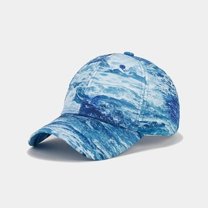 Detail of street fashion baseball cap featuring blue and white ocean wave digital print