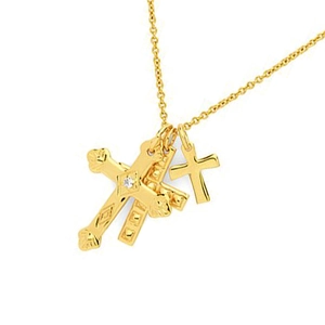 Gold layered necklace with triple cross pendants and sparkling white zircon center