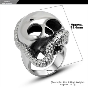 Detailed view of silver skull and snake ring showing punk rock engraving and textures
