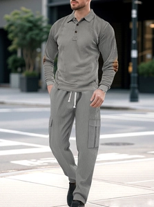 Detail showing the ribbed knit texture and buttoned polo collar on a gray lounge set