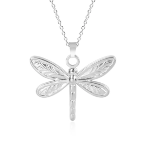 Detail shot of a silver stainless steel dragonfly pendant with textured wings and thin chain