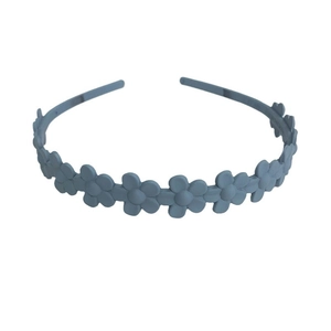 Frosted candy color headband with small flower decoration on a clean white background