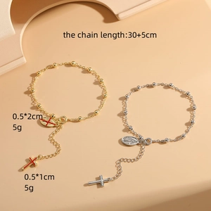 Gold and silver cross rosary bracelets with oval saint charms and bead chain