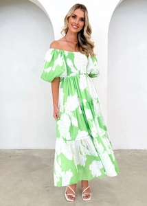 Detail of elegant green floral off-shoulder tiered maxi dress with puffy sleeves