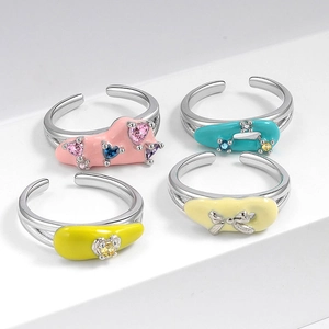 Set of four colorful drip glaze adjustable open rings with multicolor gemstones on white base