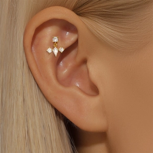 Close-up of S925 silver gold-plated stud earring with opal and marquise diamond details