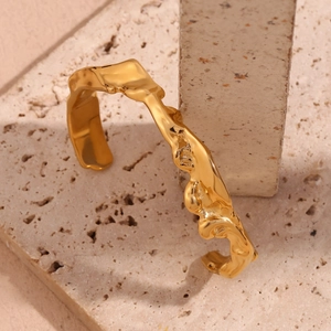 Detail showing irregular molten gold texture on 18K gold plated stainless steel cuff