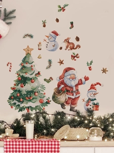 Détail de stickers muraux festifs du Père Noël et bonhomme de neige en décor de salon