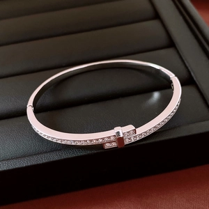 Macro shot of silver plated cross buckle bracelet with pavé cubic zirconia setting