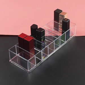 Clear acrylic lipstick organizer with multiple compartments for vanity desk storage