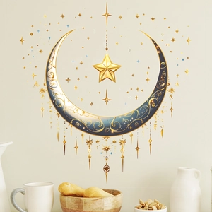 Detail of moon and stars wall sticker with gold patterns in a cozy home setting