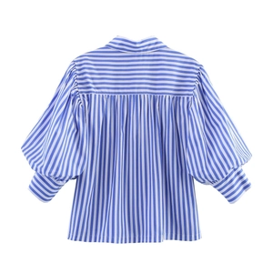Rear view of a blue and white striped poplin shirt featuring pleated back and puff sleeves
