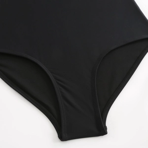 Detailed close-up of double-stitched edges on high-elastic black one-piece swimwear