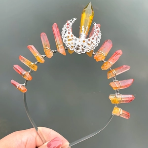 Detail of handmade crown headband with orange crystals and silver hollow moon ornament