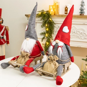 Christmas gnomes sitting on wooden sledges with gift bags by a cozy fireplace
