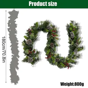 Detailed view of 180cm Christmas pine garland with red berries and pine cones