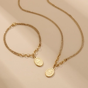 Gold layered queen coin pendant necklace and bracelet set in vintage stainless steel