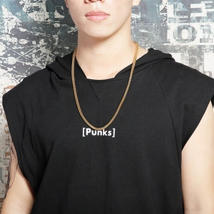Polished gold stainless steel curb chain necklace for men shown on a male model
