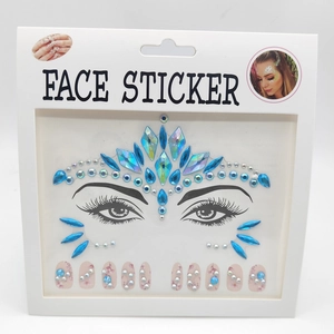 Detail of blue iridescent face jewels and pink flower nail stickers in retail packaging