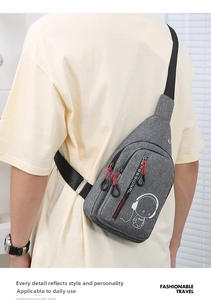Detail of grey crossbody bag featuring astronaut print and smooth dual zippers