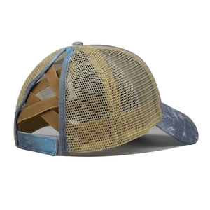 Detail view of the criss-cross elastic bands for high ponytail on washed mesh baseball cap