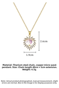 Detailed macro of pink heart zircon pendant with crystal frame on gold titanium steel chain