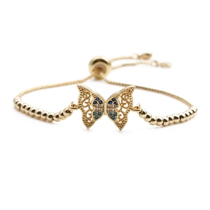 Adjustable copper butterfly bracelet with blue and white zircons on white background