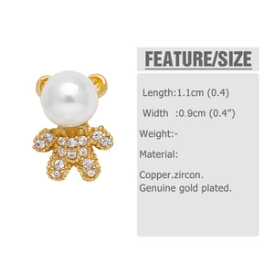Detail of 18k gold plated bear earrings with pearl head and zircon-studded body