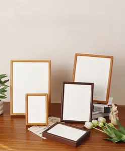 Detail of solid wood photo frames in walnut and oak finishes with mortise joint design