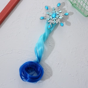 Detail of snowflake hair clip with blue gemstone and gradient braided hair extension