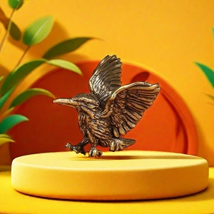 Detail of vintage copper hummingbird pendant with intricate feather texture and wings